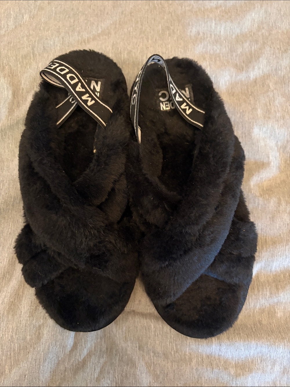 Madden women’s Black Faux Fur Crisscross Slide Sandals with Branded Sling